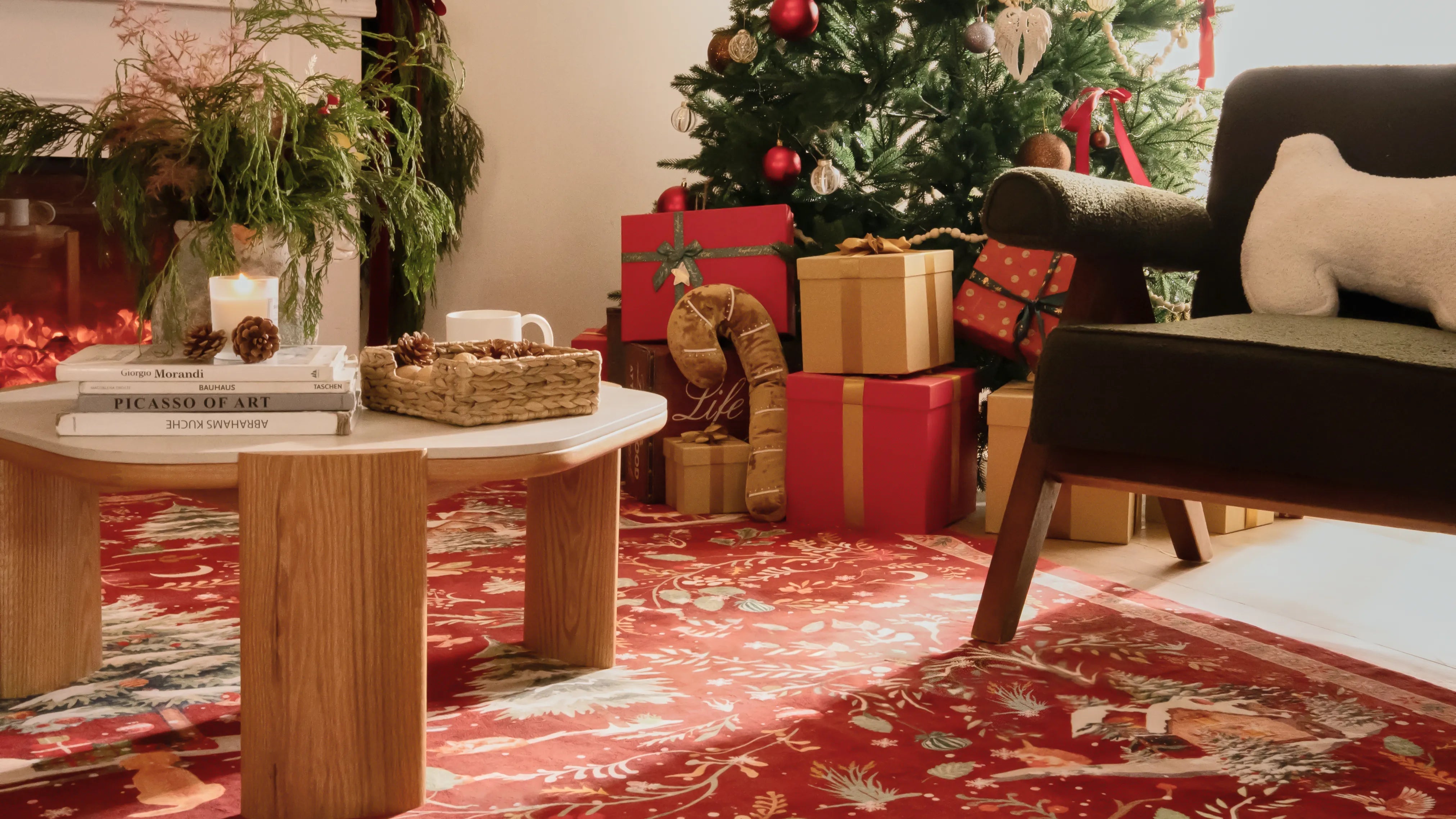 Living room with Christmas decorations including a tree, presents, and a red rug.