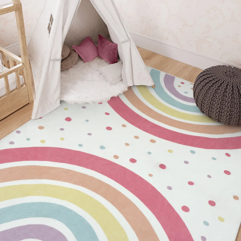 Rainbow kids rug in playroom with teepee and decor
