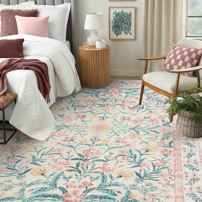 Pink floral rug beside white bed