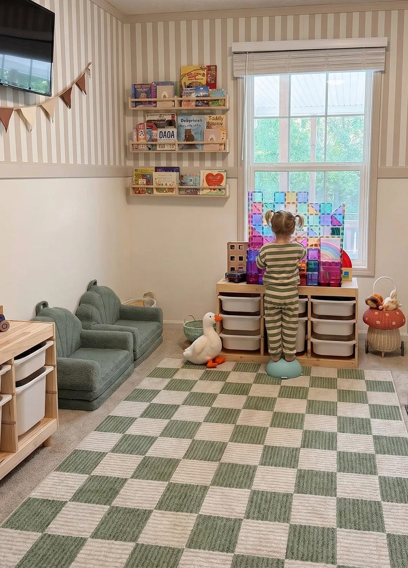 Kids playroom with green checkerboard rug and toy storage