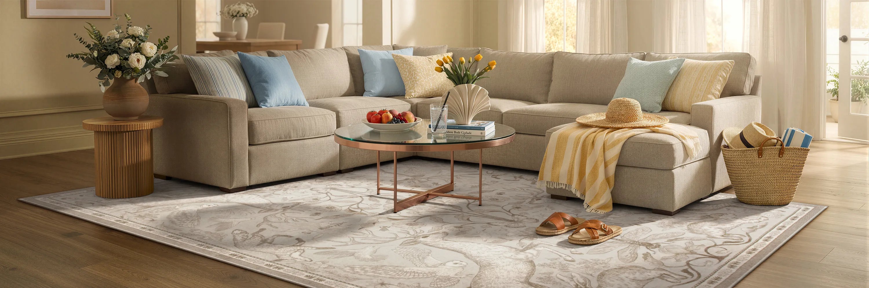 Living room with a beige sectional sofa, coffee table, and decorative items.